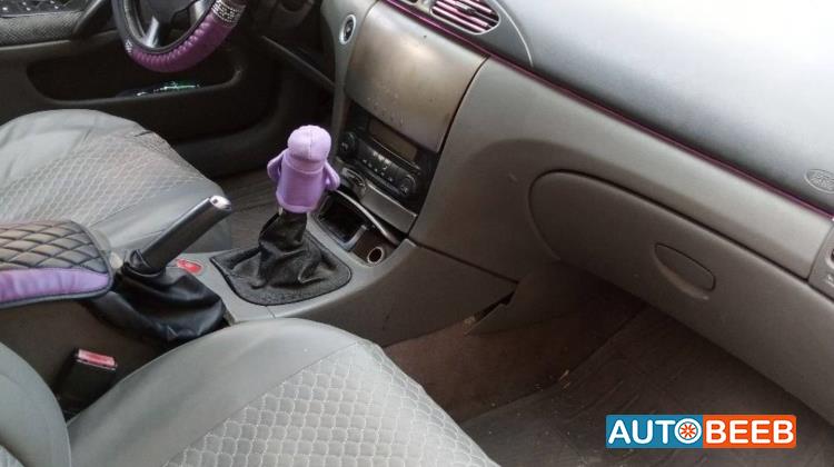 رينو لاجونا 2004