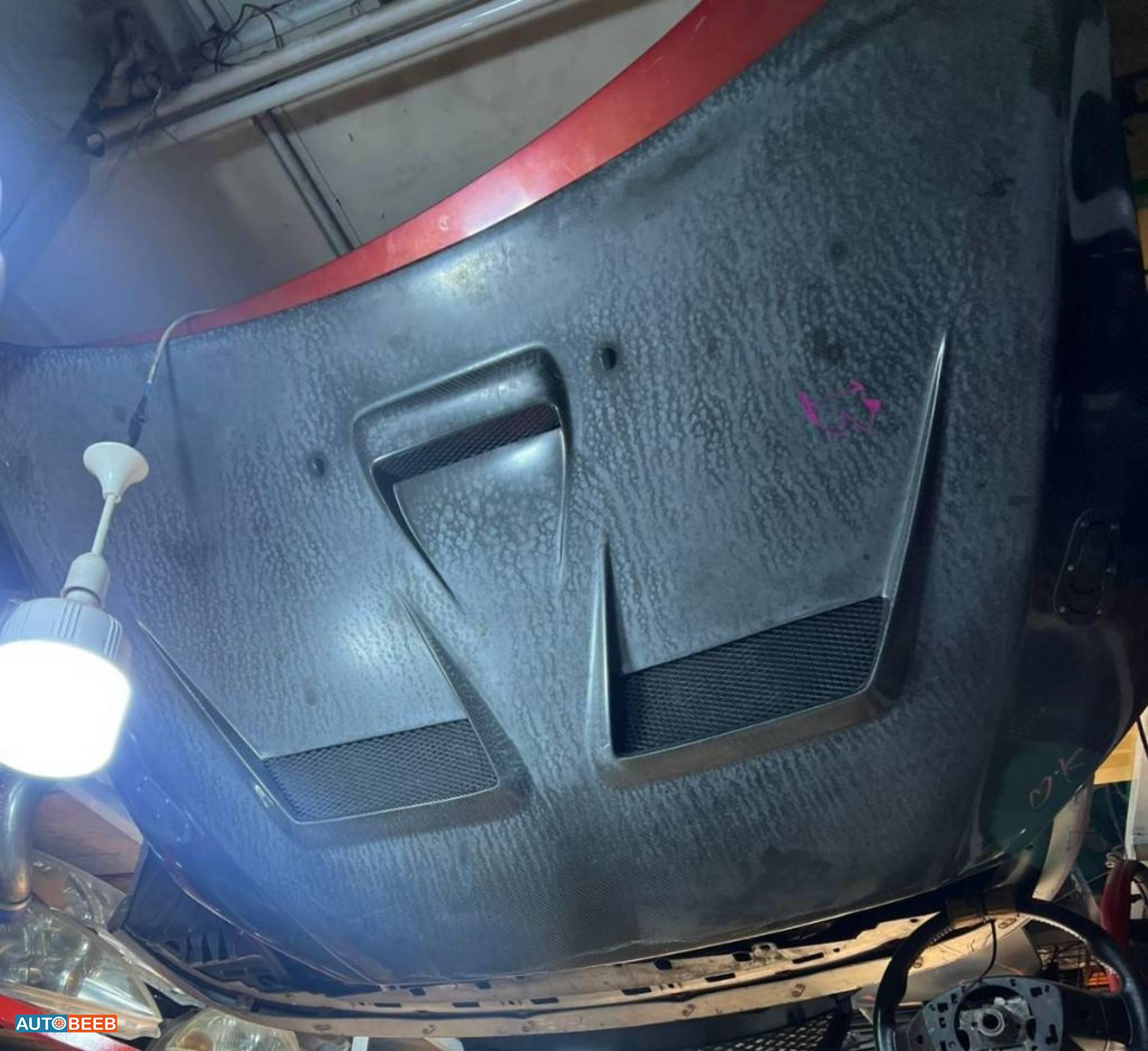 غطاء امامي ميتسوبيشي لانسر ايفو كاربون 2008 2009 2010 2011