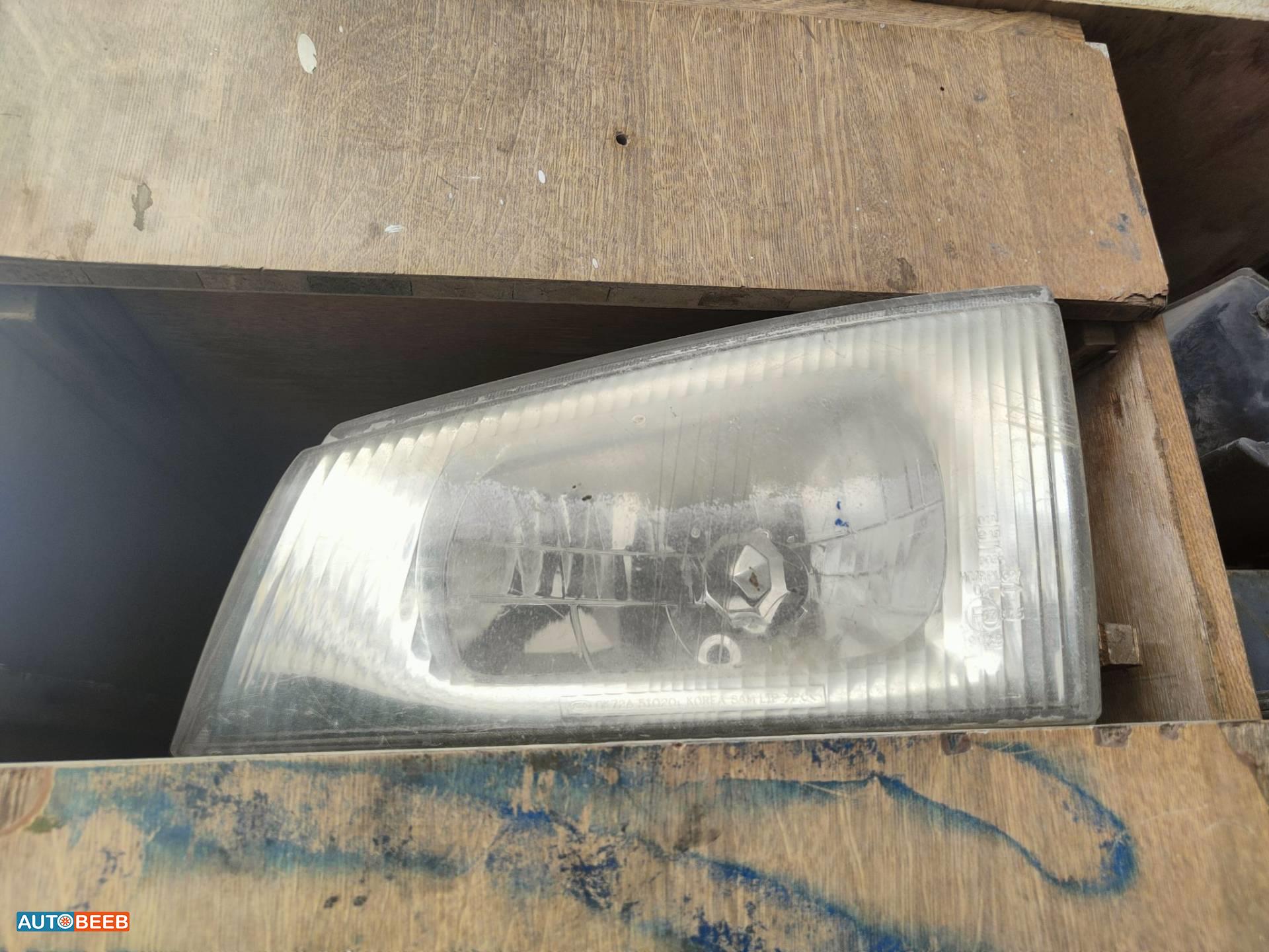 ضوء امامي يمين شمال كيا بريجو 2000