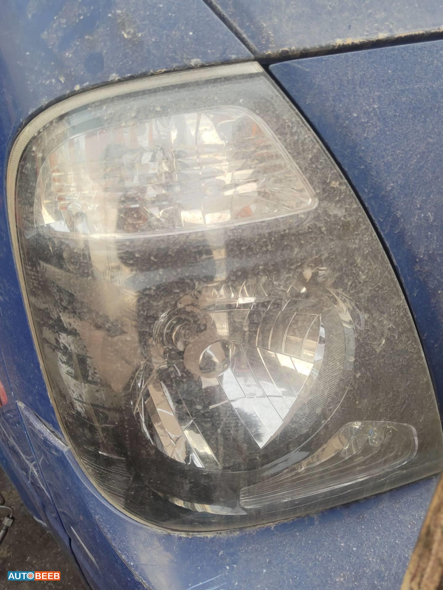 ضوء امامي يمين كيا بنجو 3 2014 2015